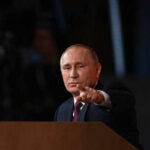 Trump’s Sanctions Crush Russian Economy Person pointing while speaking at a podium