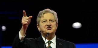 A speaker passionately addressing an audience at a conference