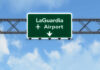 LaGuardia Runway Crash Exposes Alarming Safety Flaws Road sign indicating direction to LaGuardia Airport