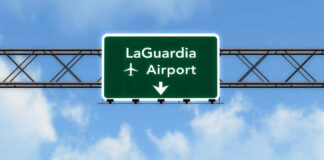 Road sign indicating direction to LaGuardia Airport