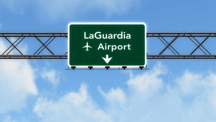 shutterstock_314263430.jpg Road sign indicating direction to LaGuardia Airport