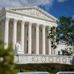 Supreme Court’s Decision Sparks Voting Rights Chaos Supreme Court building with columns and a statue.
