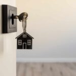 Hidden Space Discovered—Could This Happen to You? A key with a house-shaped keychain inserted into a door lock