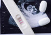 Court Ruling Sparks Abortion Access CHAOS Pregnancy test next to an ultrasound image and two white pills
