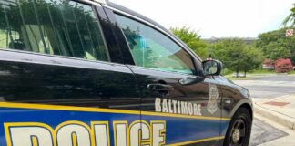 Side view of a Baltimore police car parked on a street