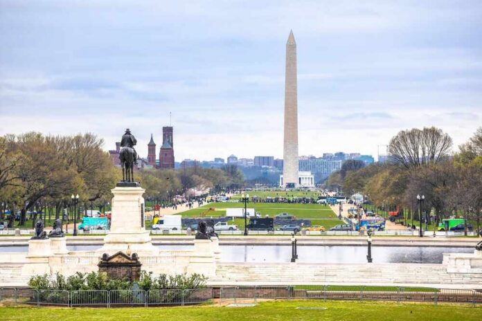 shutterstock_2650561519.jpg View of the Washington Monument from a park with a statue in the foreground