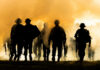 Massive Russian Losses? What’s the Real Story? Silhouettes of soldiers walking through smoke at sunset