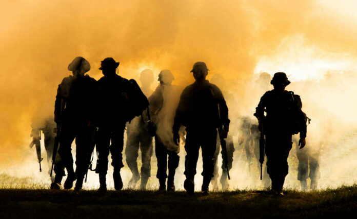 silhouettes-of-army-soldiers-in-the-fog1912772680jpg Silhouettes of soldiers walking through smoke at sunset