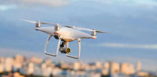 Drone flying above a cityscape.
