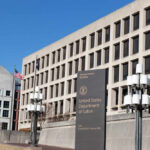 Exterior view of the United States Department of Labor building with flags