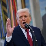 Anti-Weaponization Fund—DOA Or Dark Pause? A man speaking passionately into a microphone with his hand raised