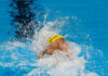 Viral Clip Twists Storm, Code Violations Swimmer in yellow cap racing in pool