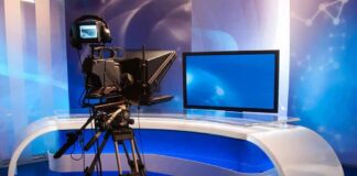 Television studio with camera and news desk