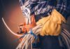 AI Is Coming, But These Jobs Aren’t Budging Electrician holding coiled cables with tool belt