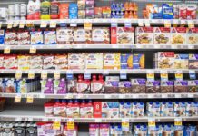 The Latest Grocery Squeeze Hides In Plain Sight Grocery aisle shelves with protein bars and shakes