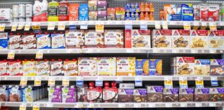 Grocery aisle shelves with protein bars and shakes