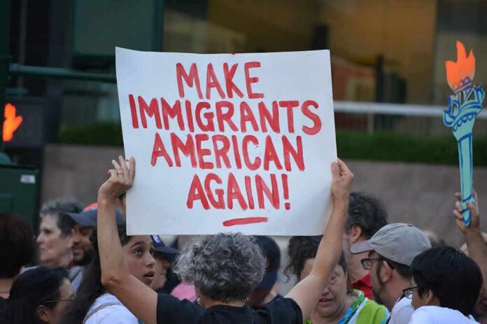 Protester holds a sign at a crowded street demonstration